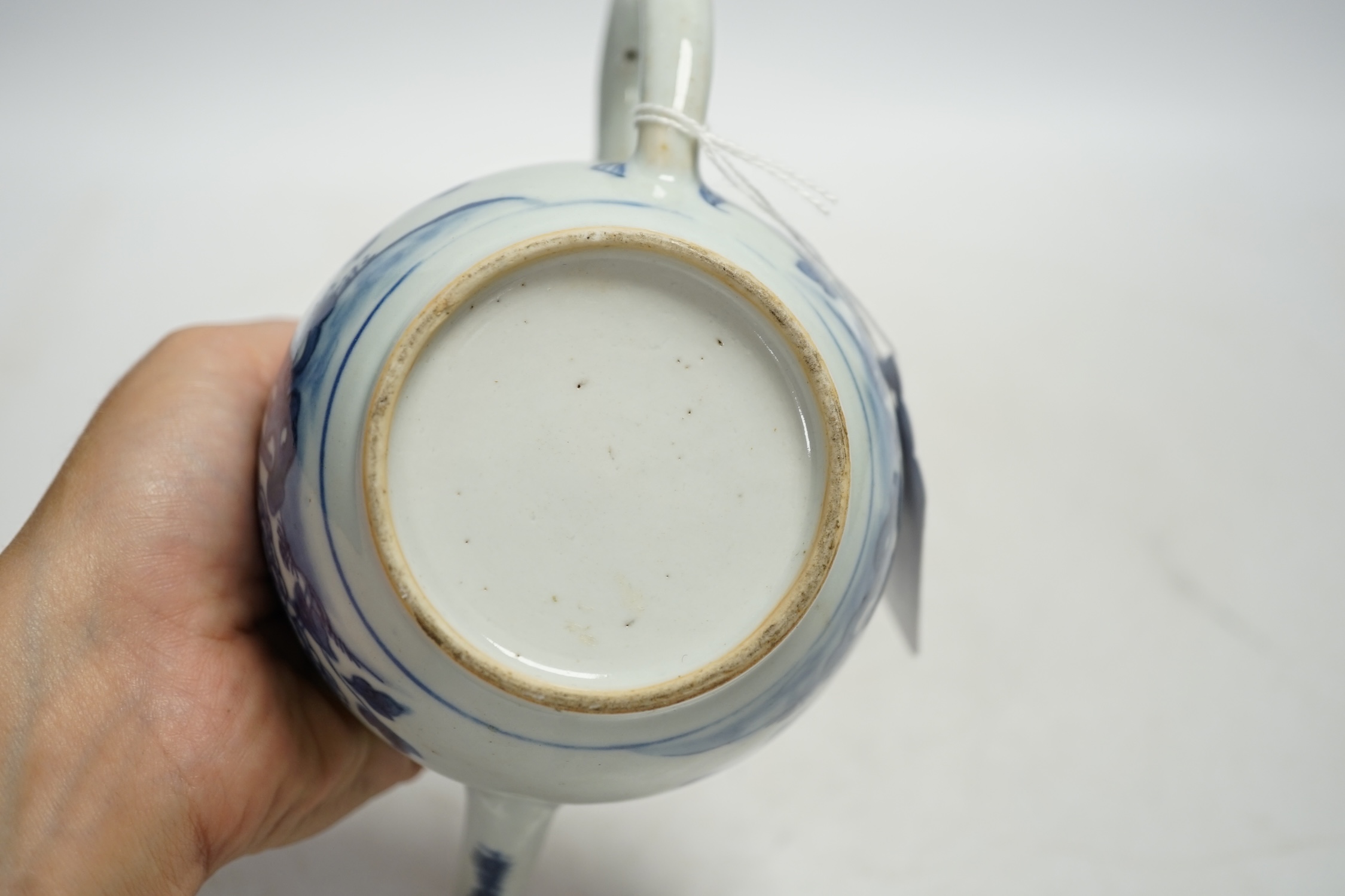 A Chinese blue and white teapot and cover, Qianlong period, 13cm high. Condition - fair